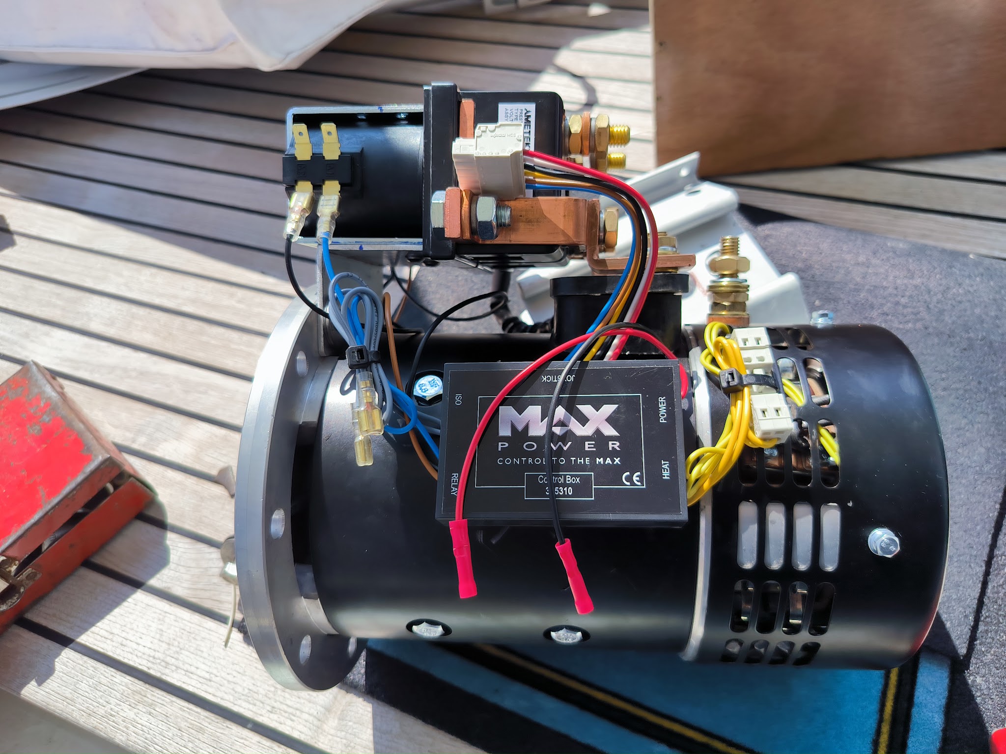 Motor with wiring on a teak deck